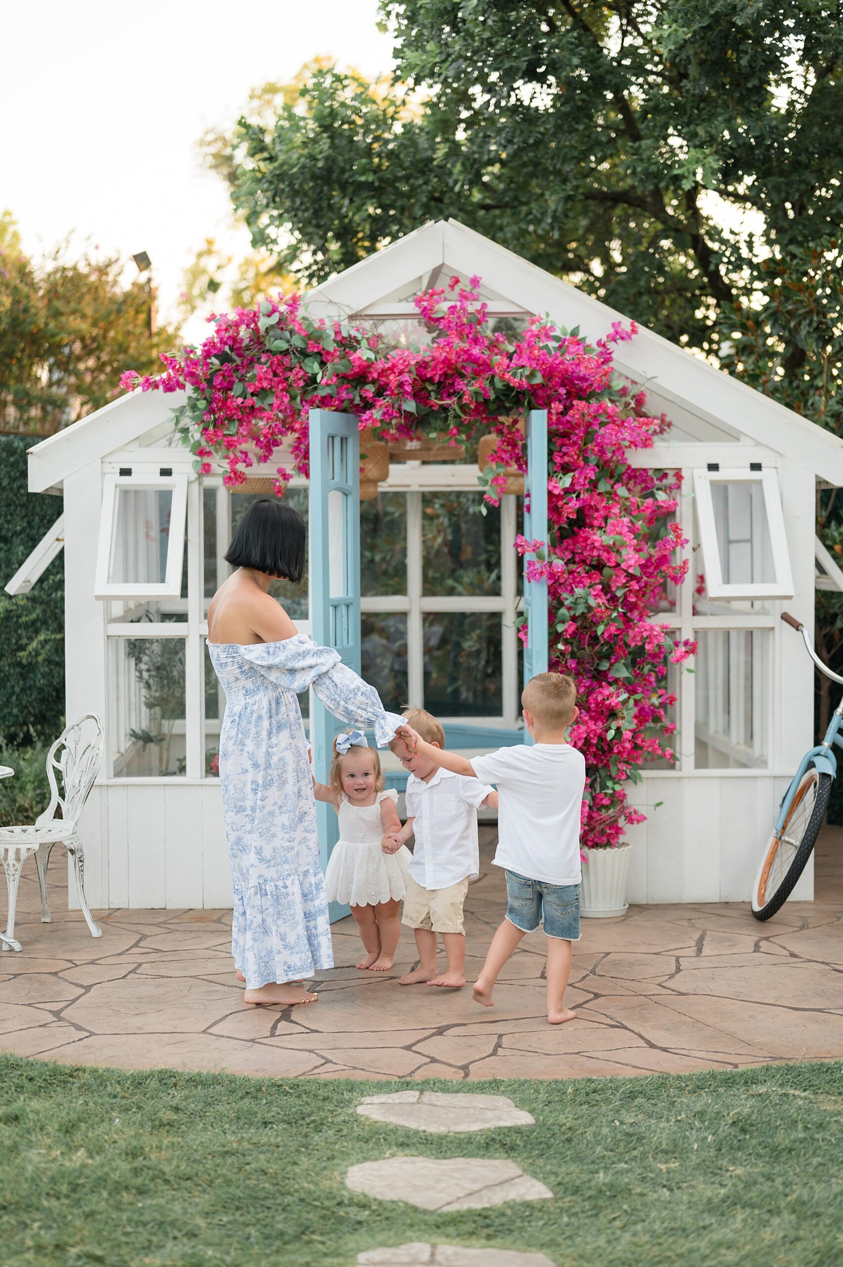 mom and children circle around together photographed by Lindsey Dutton Photography, a Dallas Family photographer
