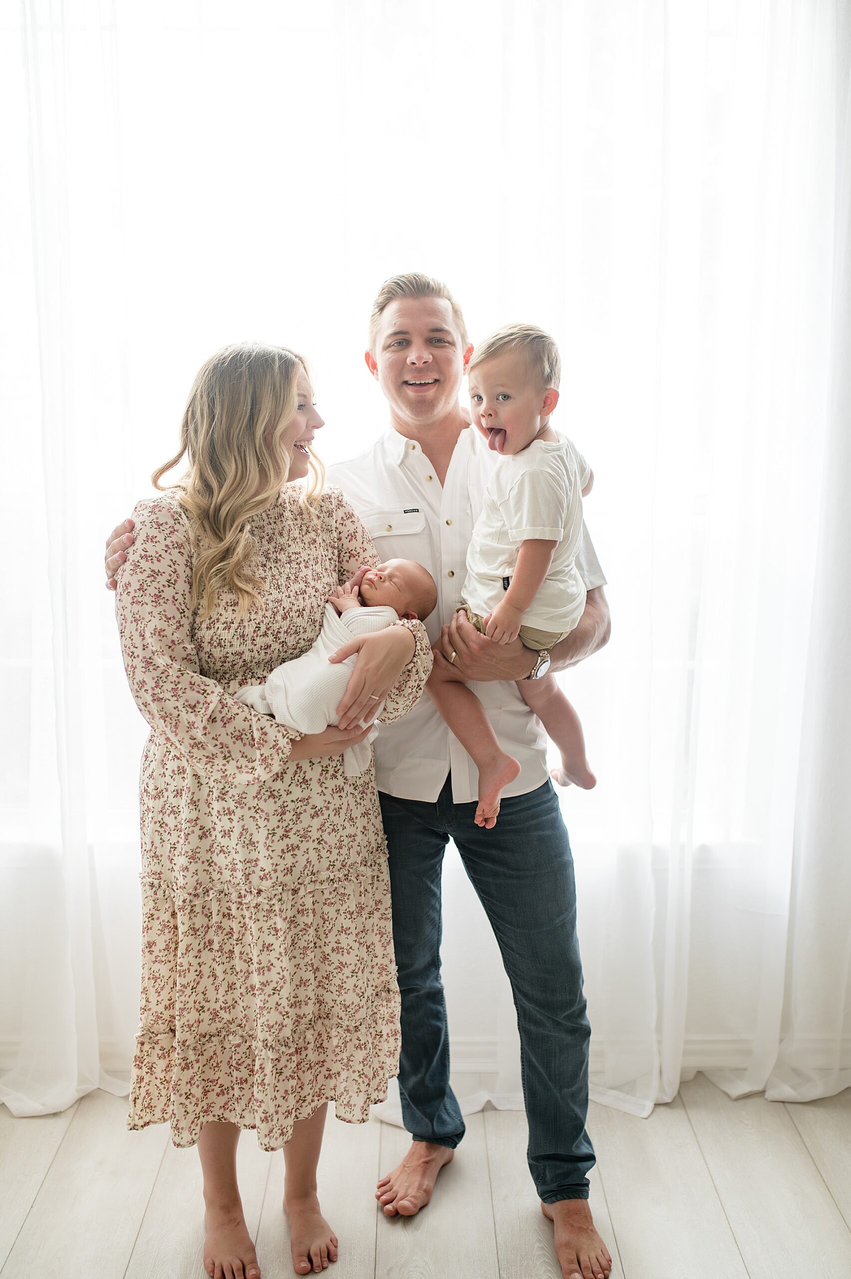 candid family photos during newborn studio session taken by Lindsey Dutton Photography, a Dallas Newborn photographer