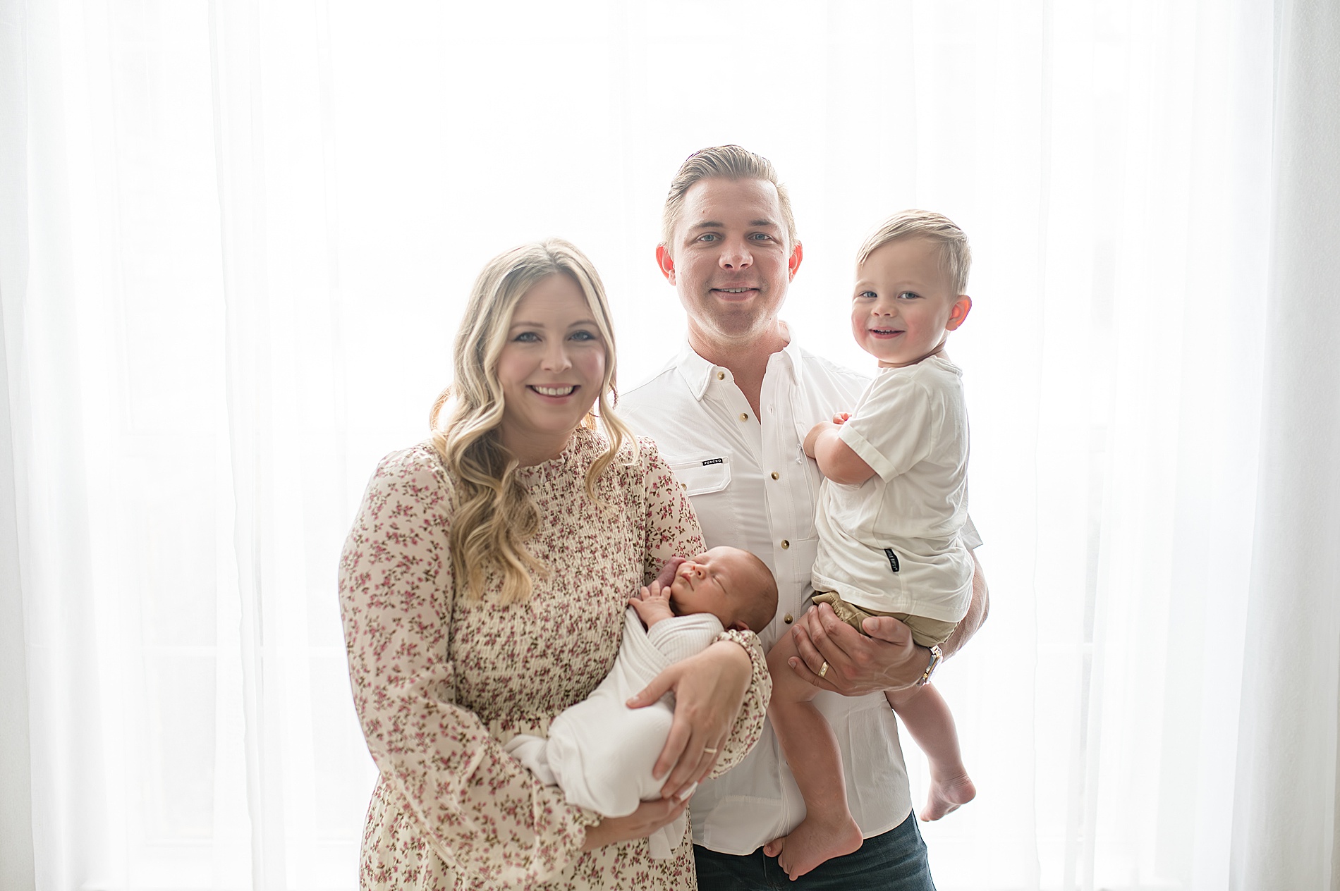 new family of four during Simple Studio Newborn Session in Dallas, Texas photographed by Lindsey Dutton Photography, a Dallas Newborn photographer