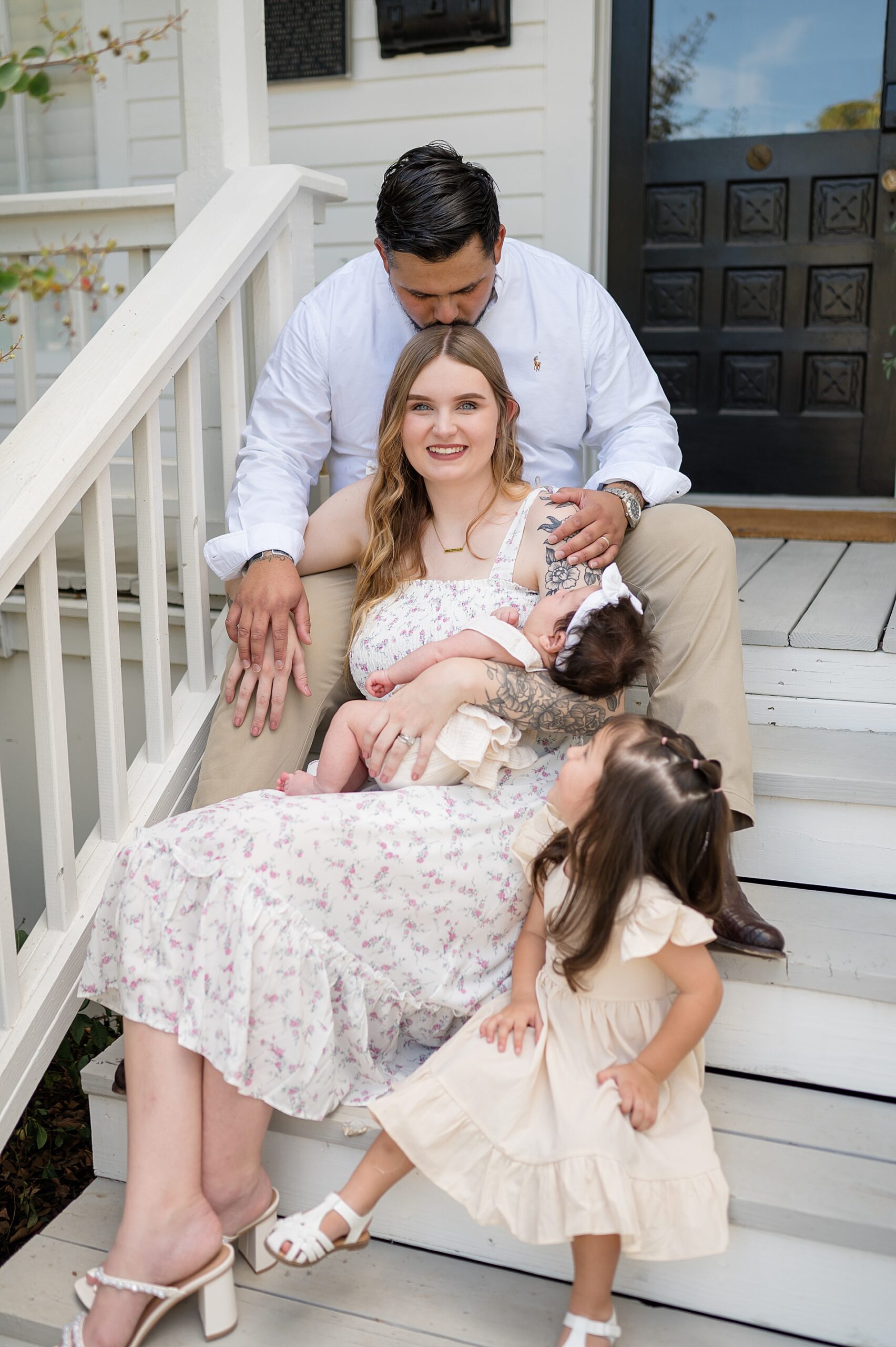 family of four sits on stairs of Beverly Harris House Family | McKinney, TX family photography