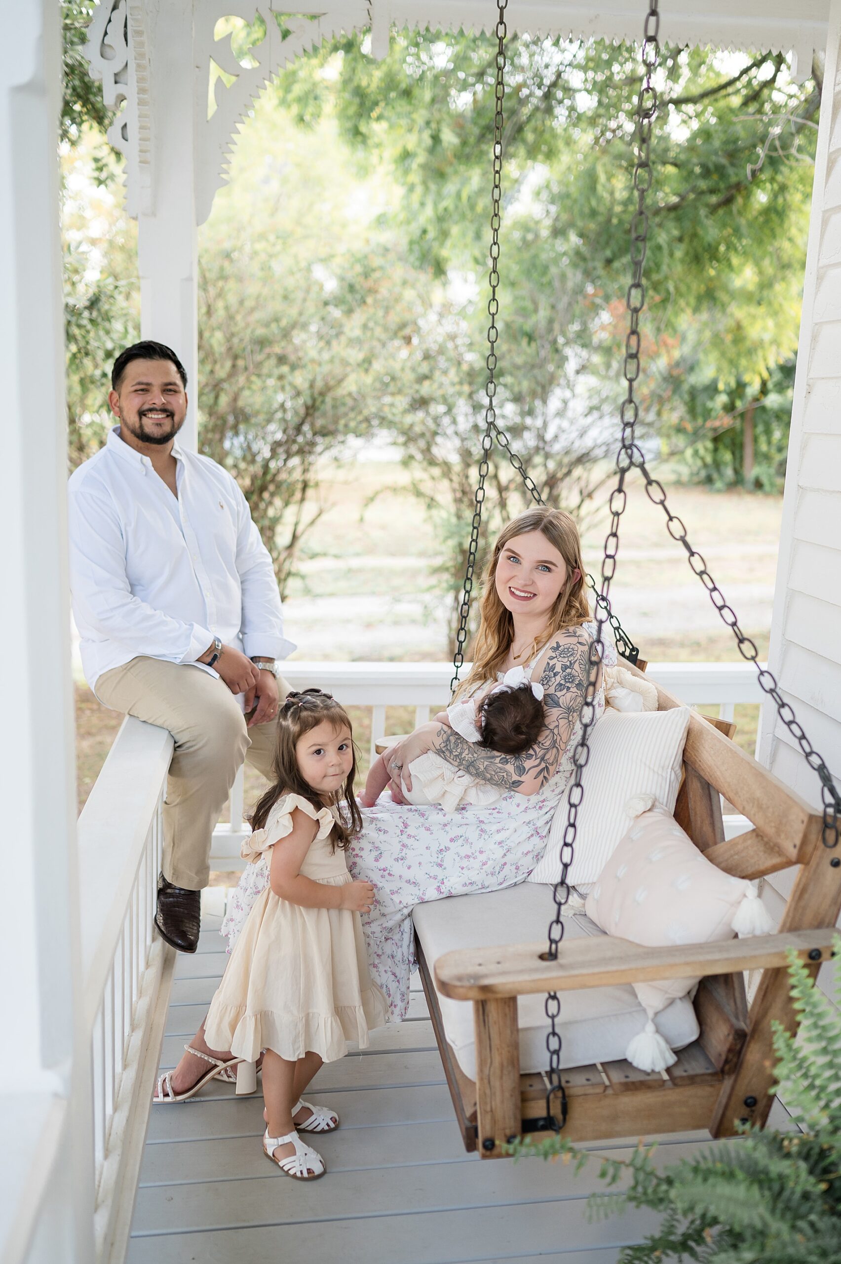 family sits on porch screen at Beverly Harris House in McKinney, TX