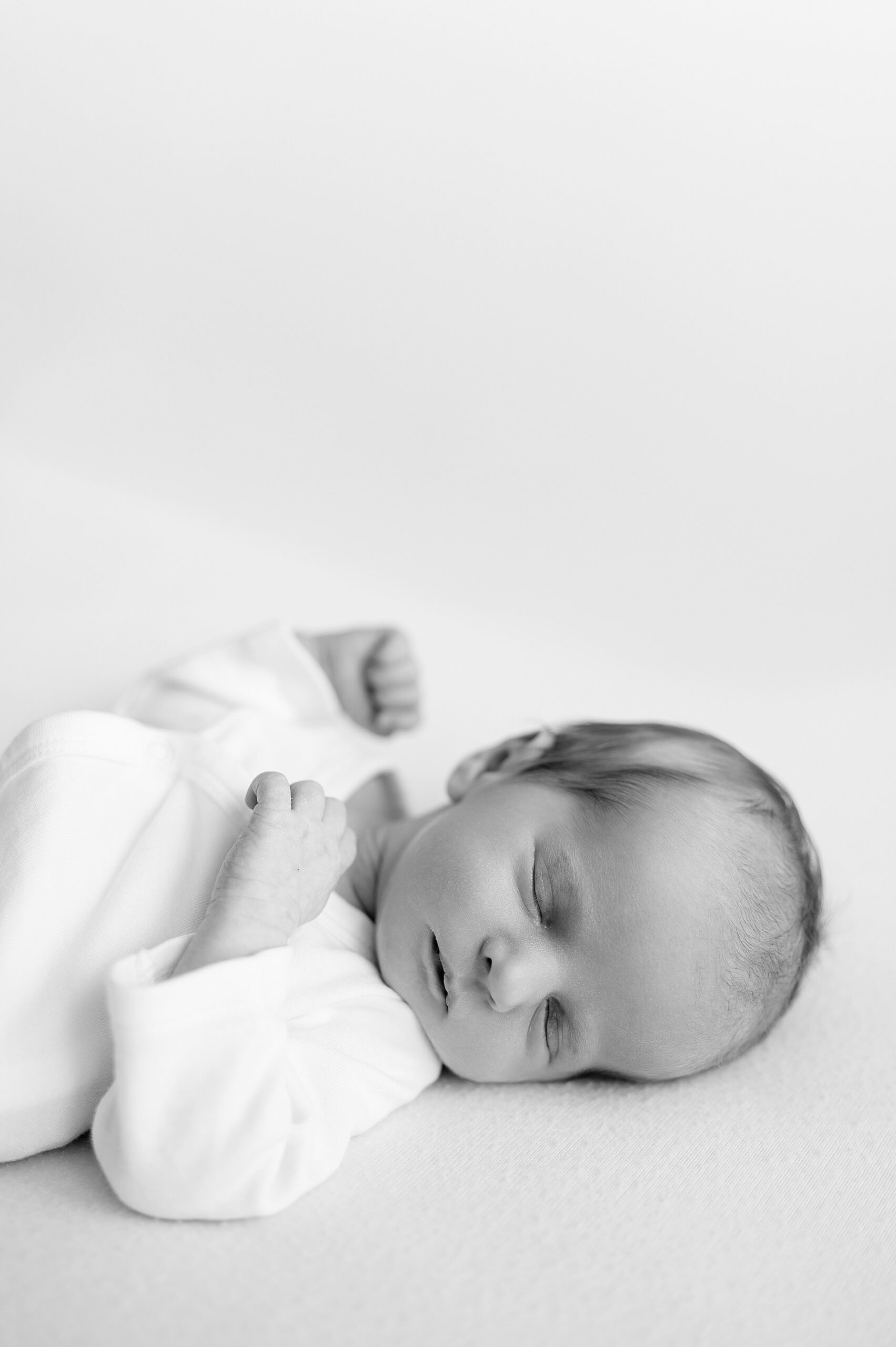 black and white photo of newborn | Simple newborn photography by Frisco Newborn Photographer