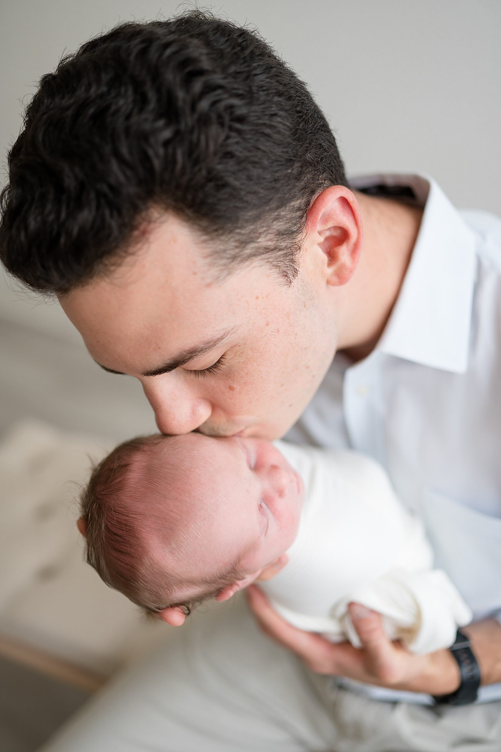 dad kisses newborn son | Prosper Texas newborn photographer