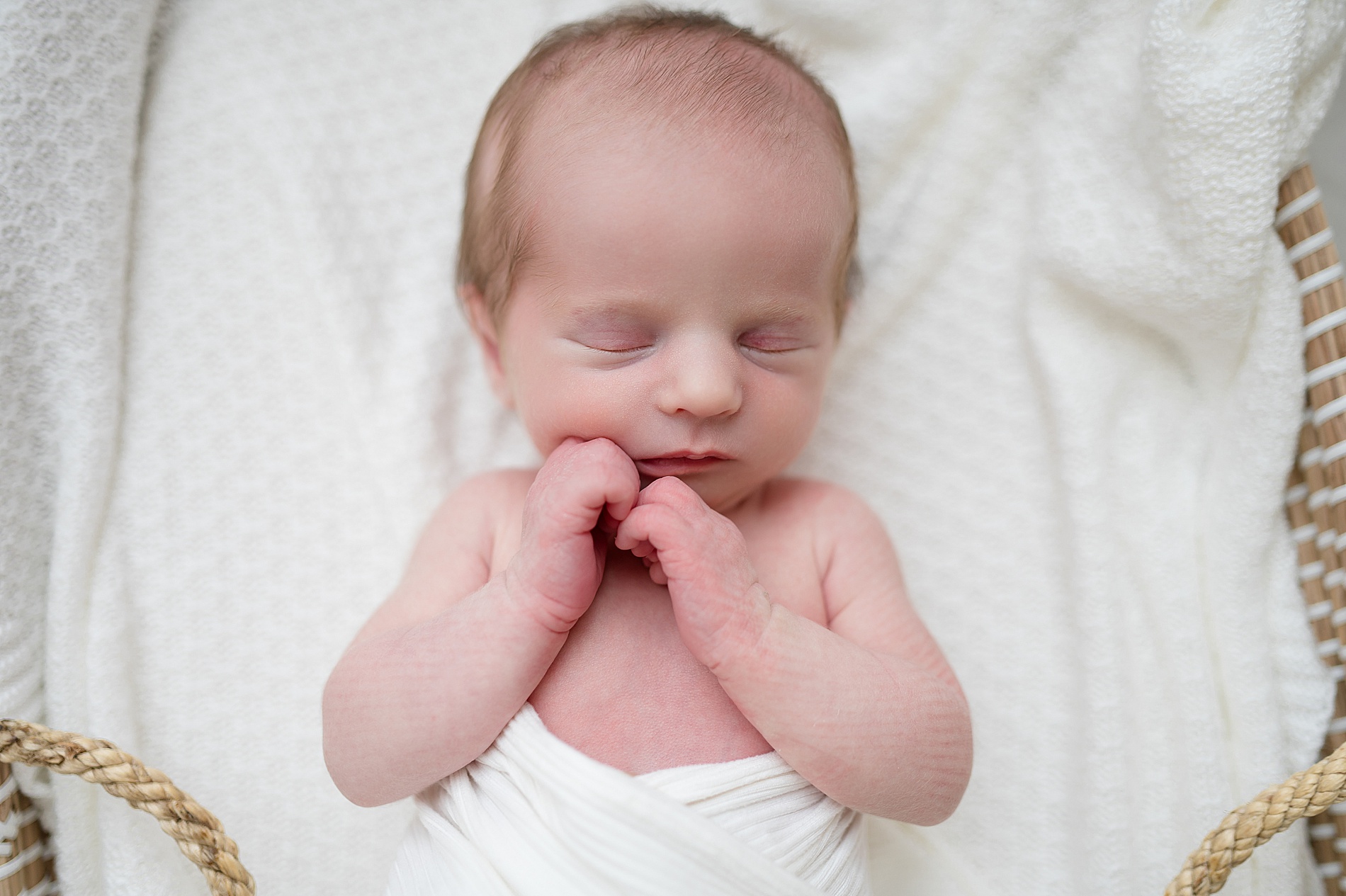 newborn sleeps with arms curled by face | Frisco TX Newborn photographer