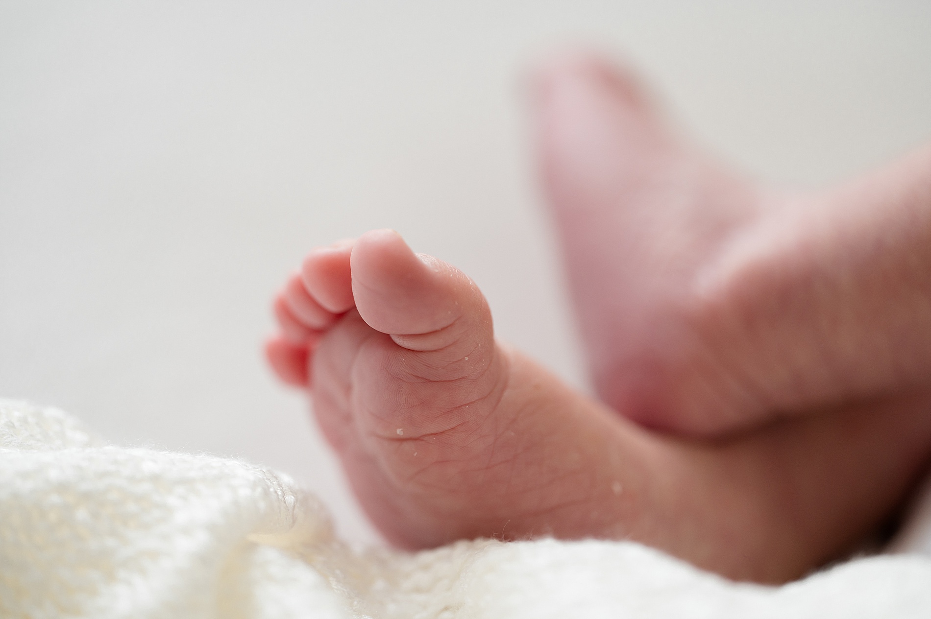 tiny feet and toes of newborn