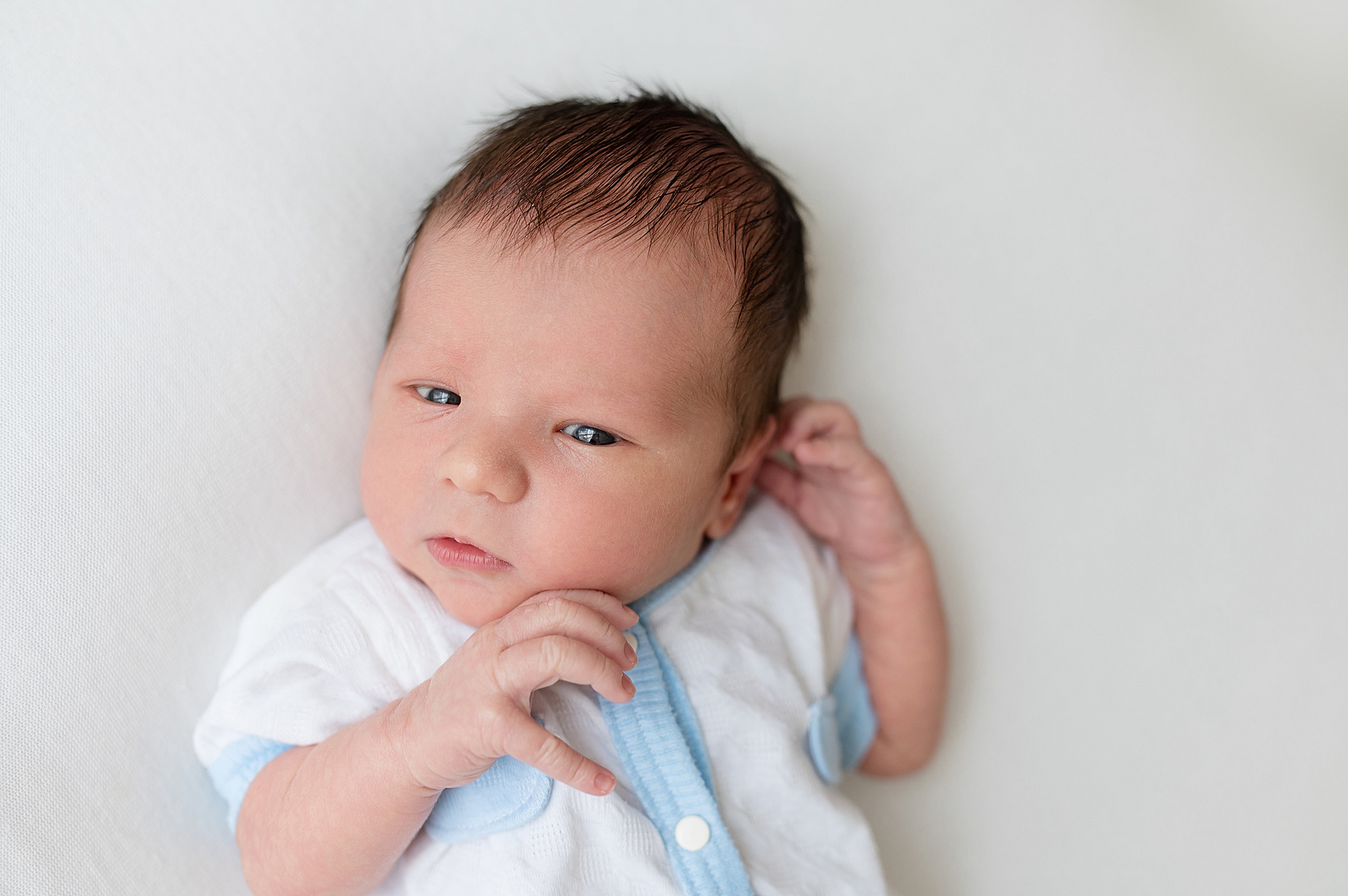 timeless studio newborn photos by photographer in Frisco TX
