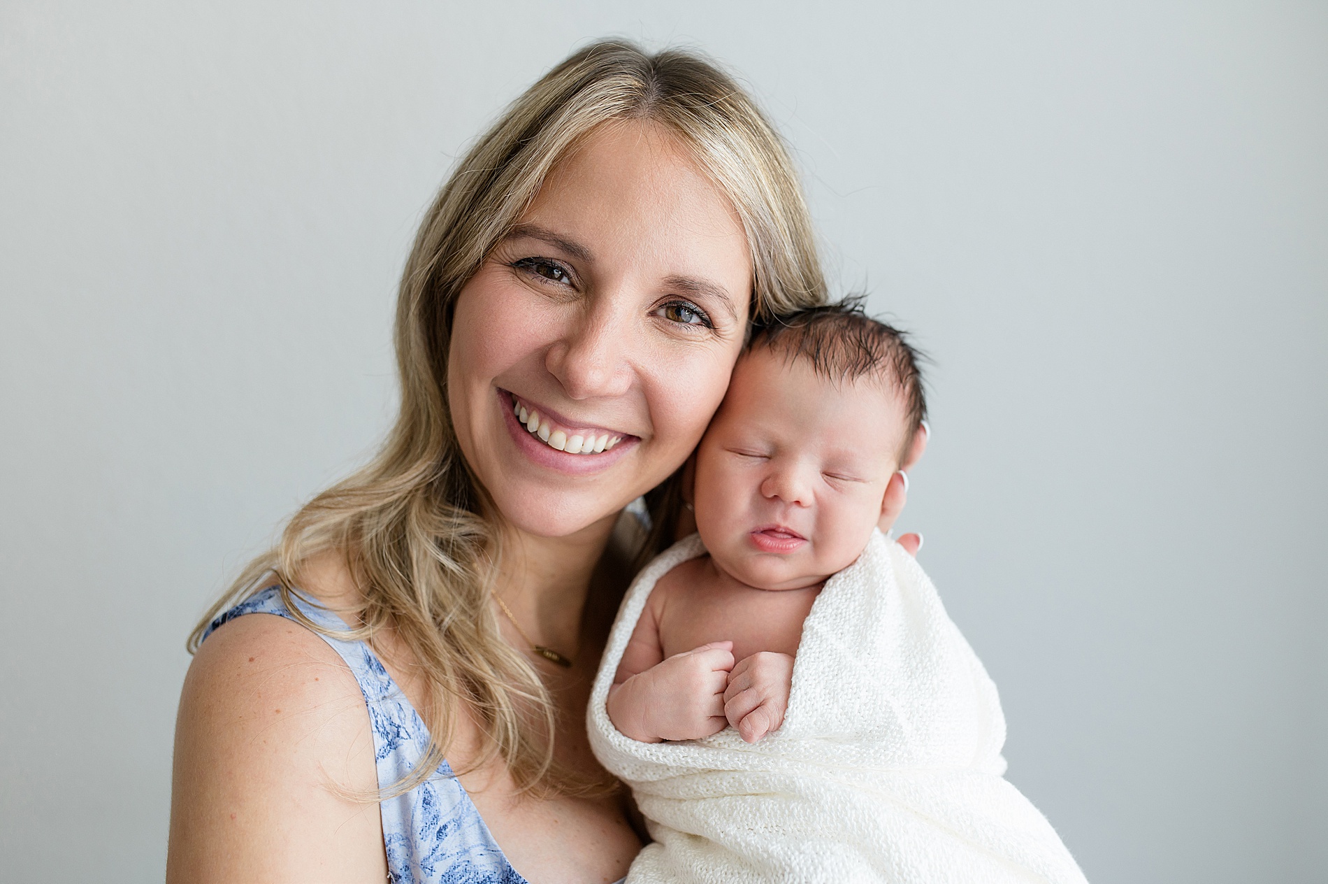 mom and newborn during studio session in Frisco