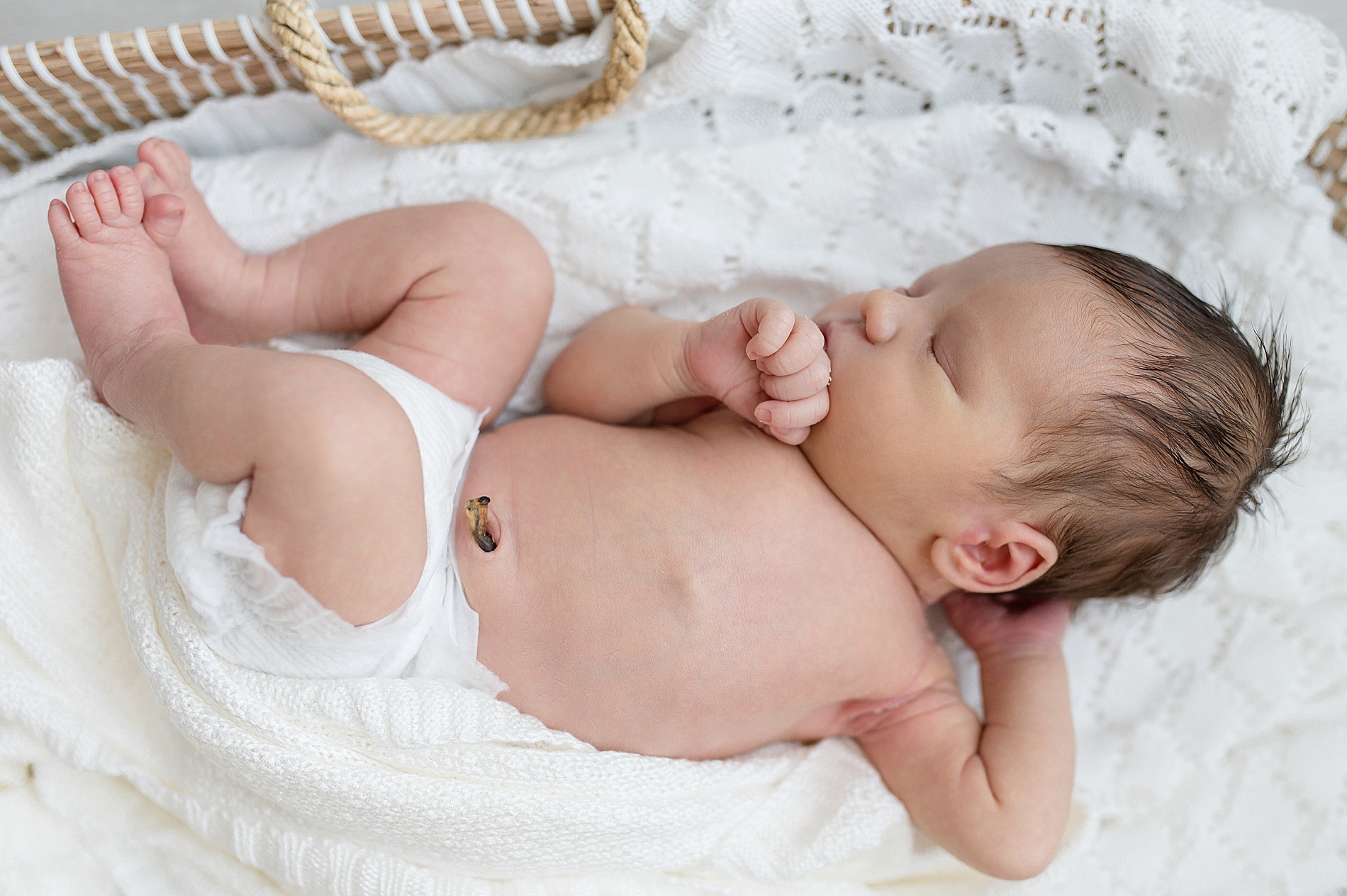newborn sleeps in bassinet | Stress-Free Studio Newborn Sessions | 5 Reasons a Studio Session is Perfect for New Parents