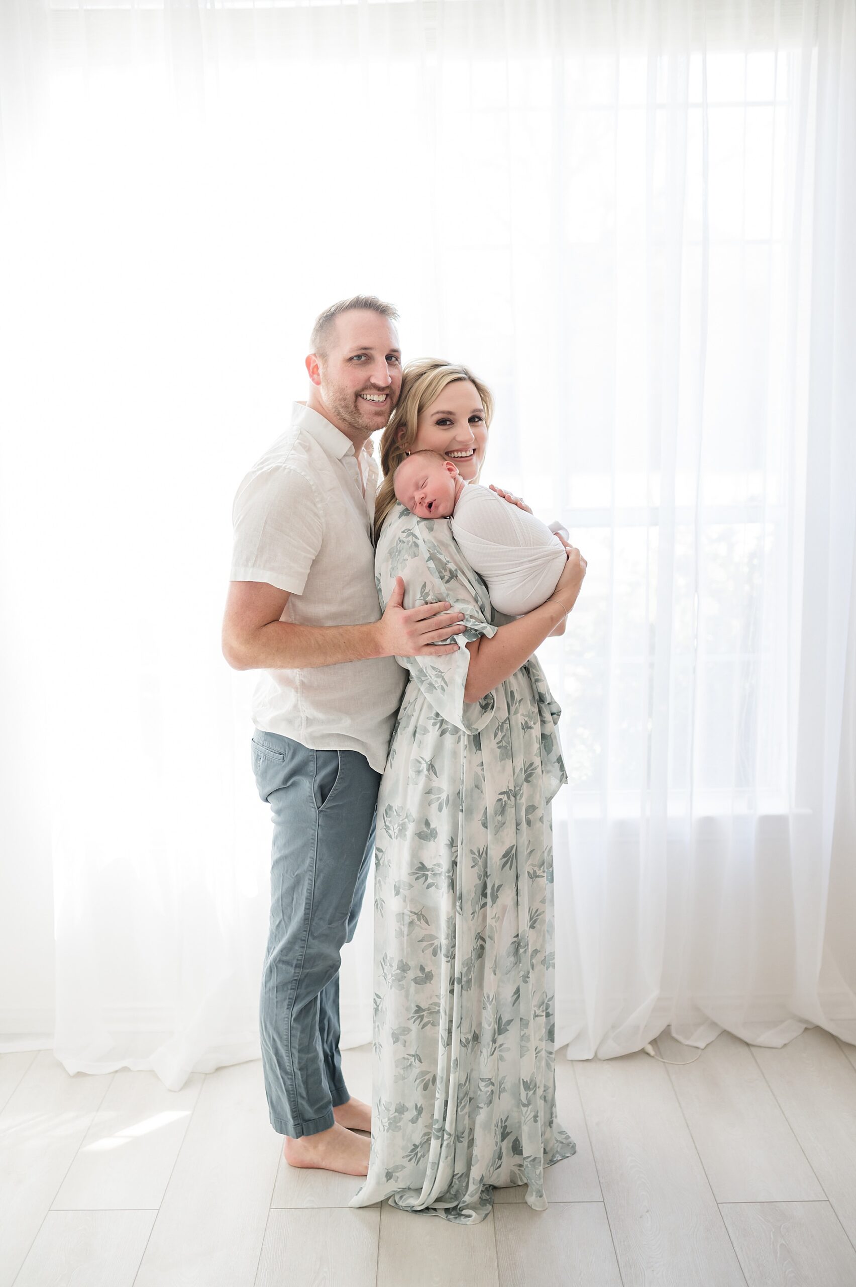 Light and airy newborn portraits by window