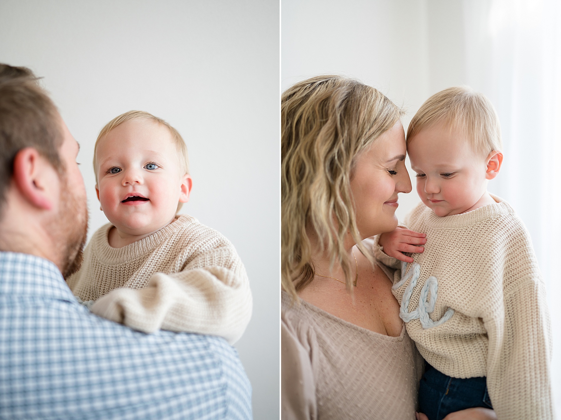 parents hold one year old