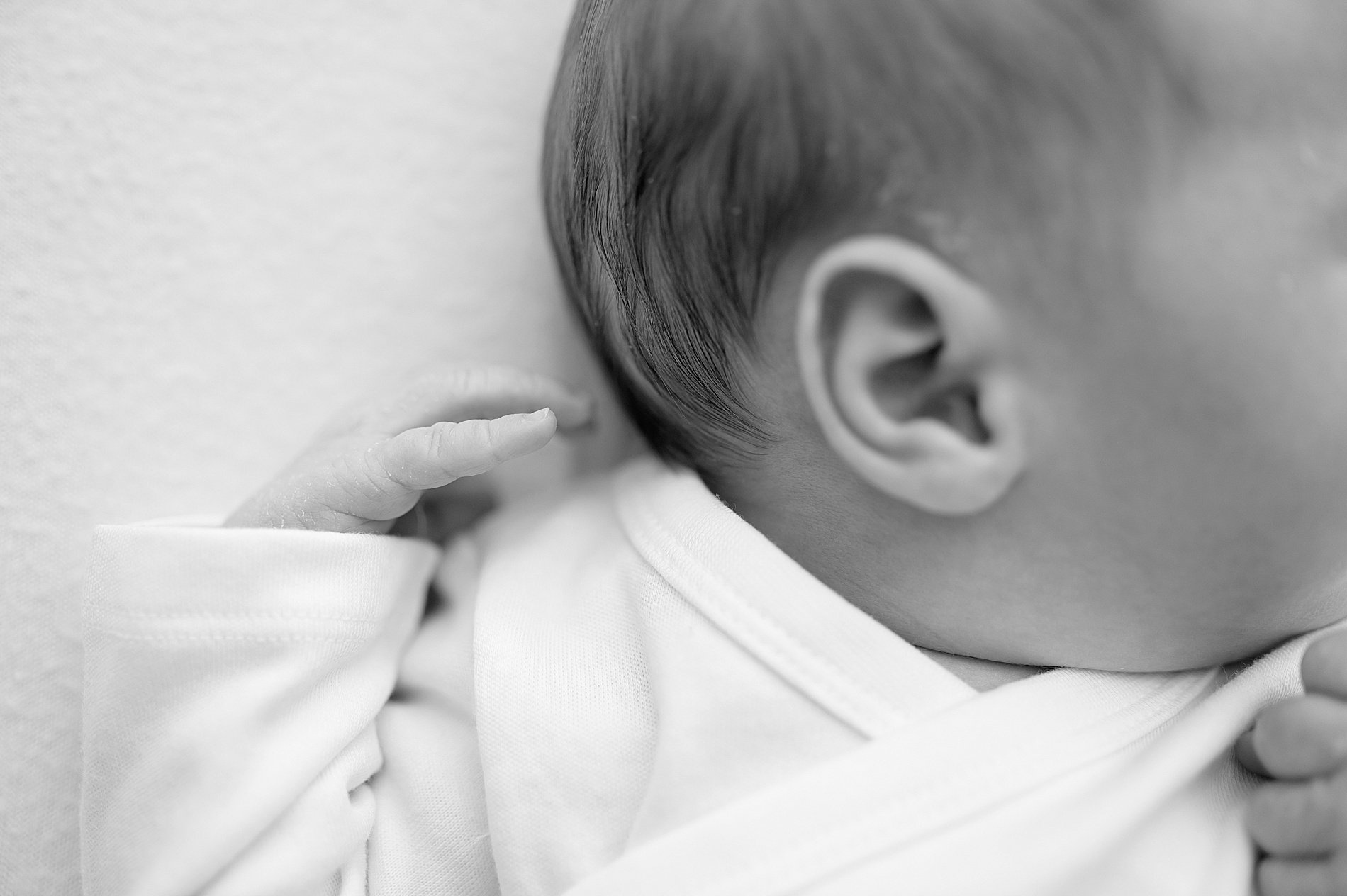 newborn's little ear and features