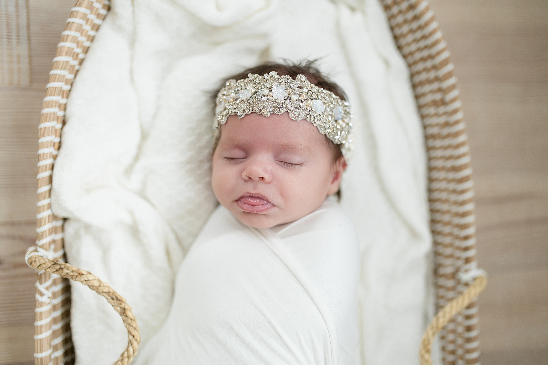 newborn girl with headband sleeps during timeless newborn photos by McKinney TX photographer