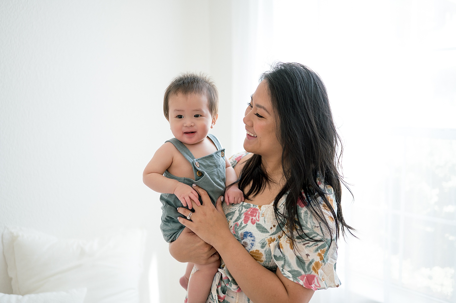 mom holds one year old son