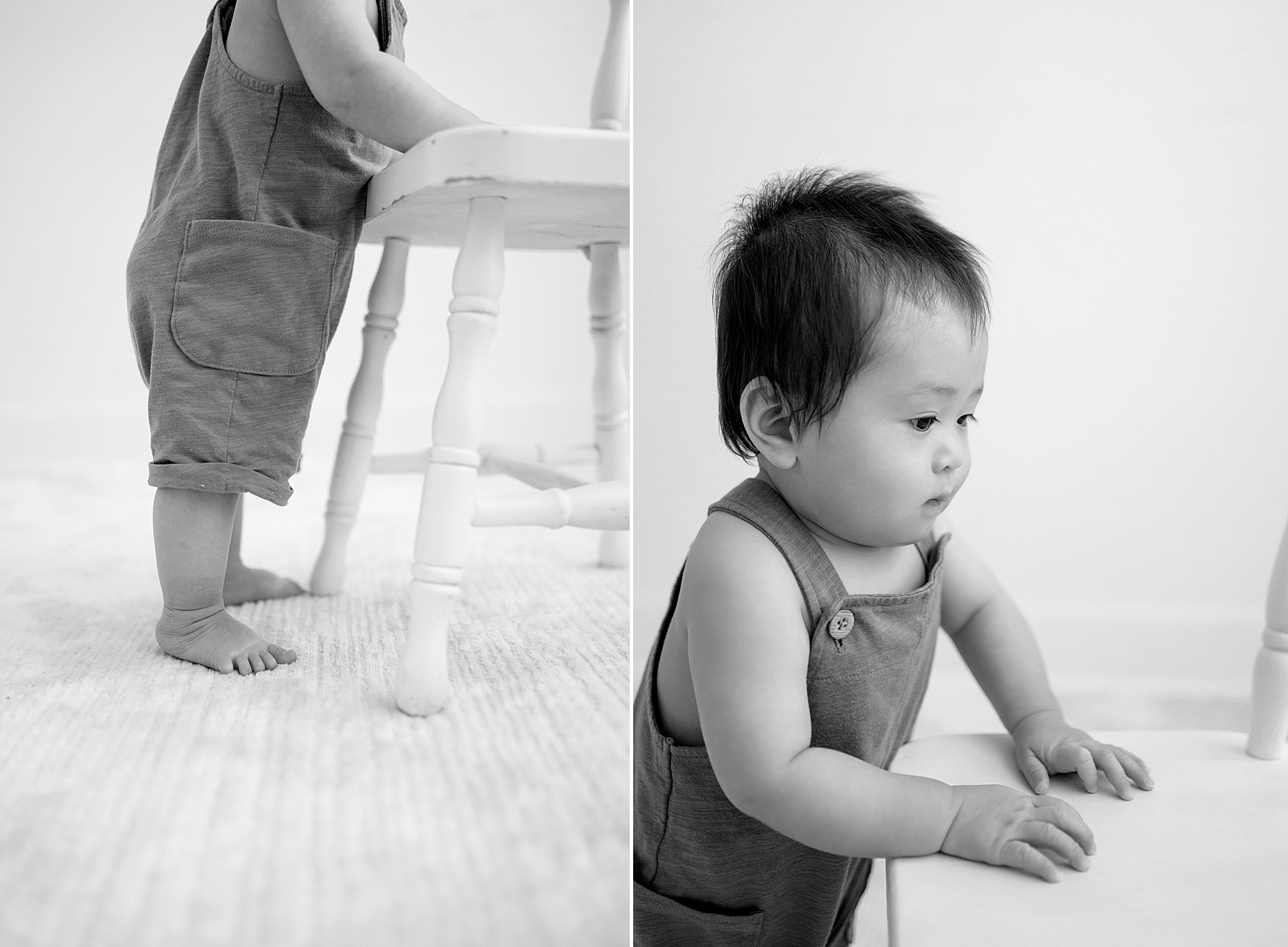 little boy pulls himself up on chair