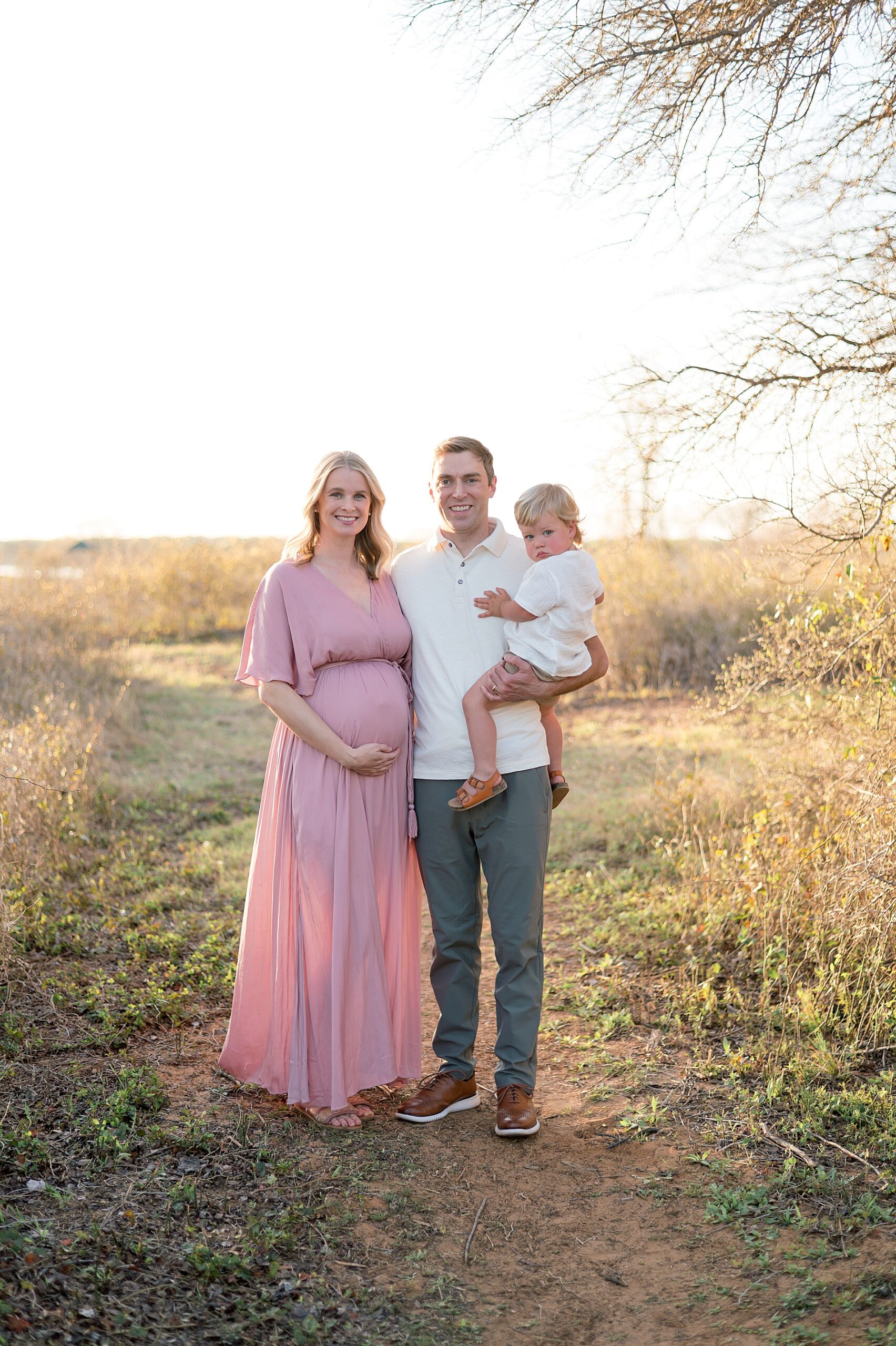family of three during winter maternity session
