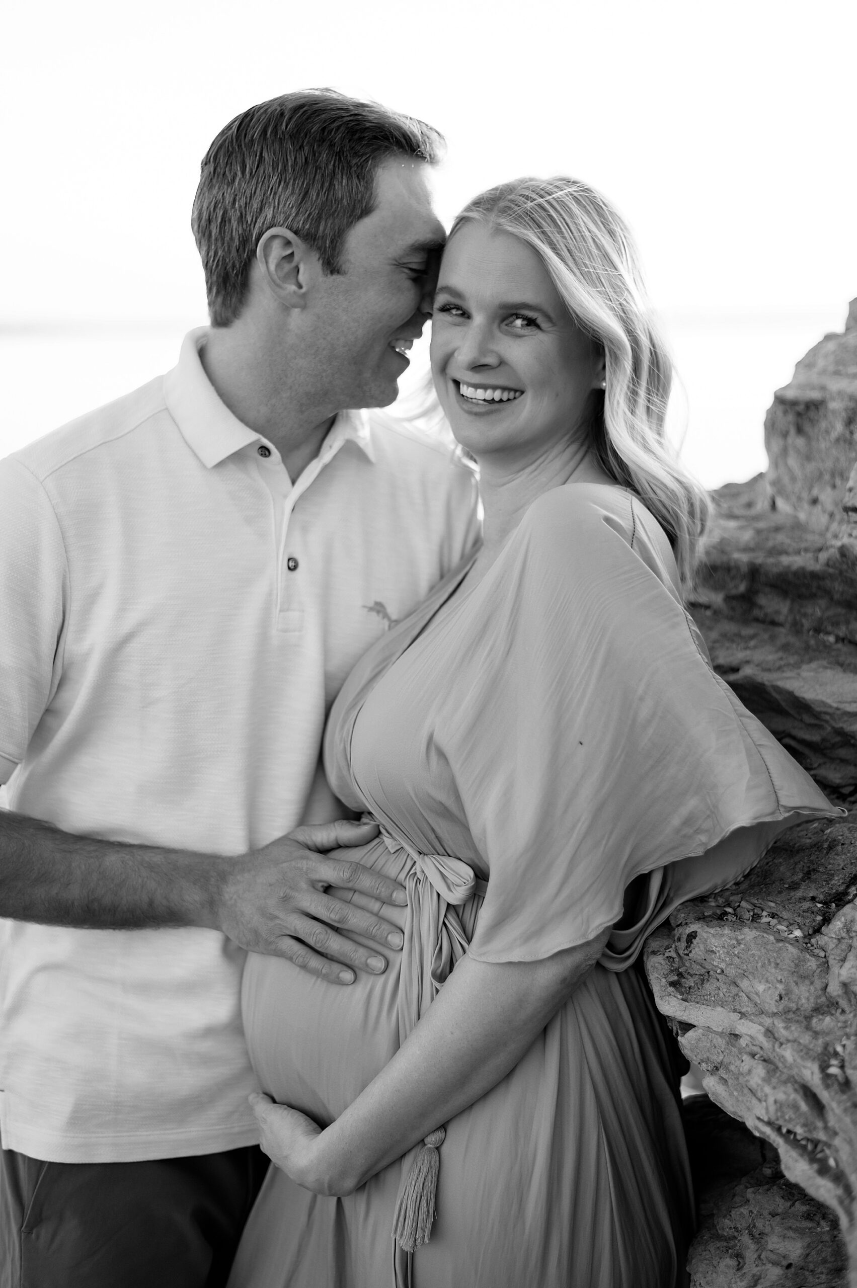 candid couples photo from Winter Lakeside Maternity Session
