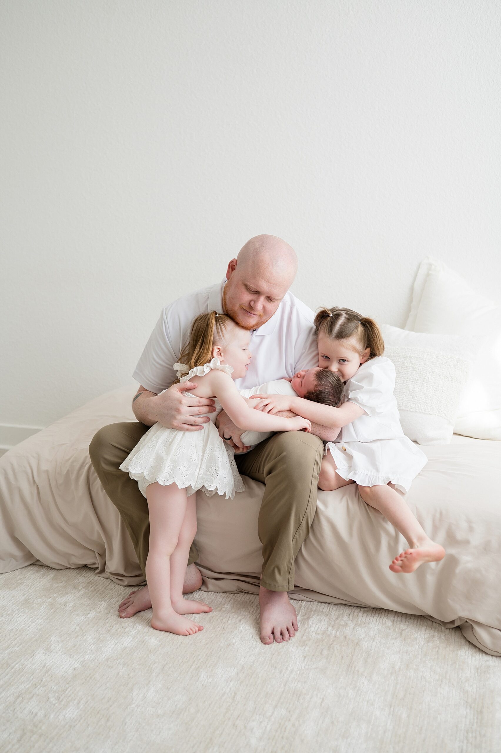 dad with 2 daughters and newborn boy