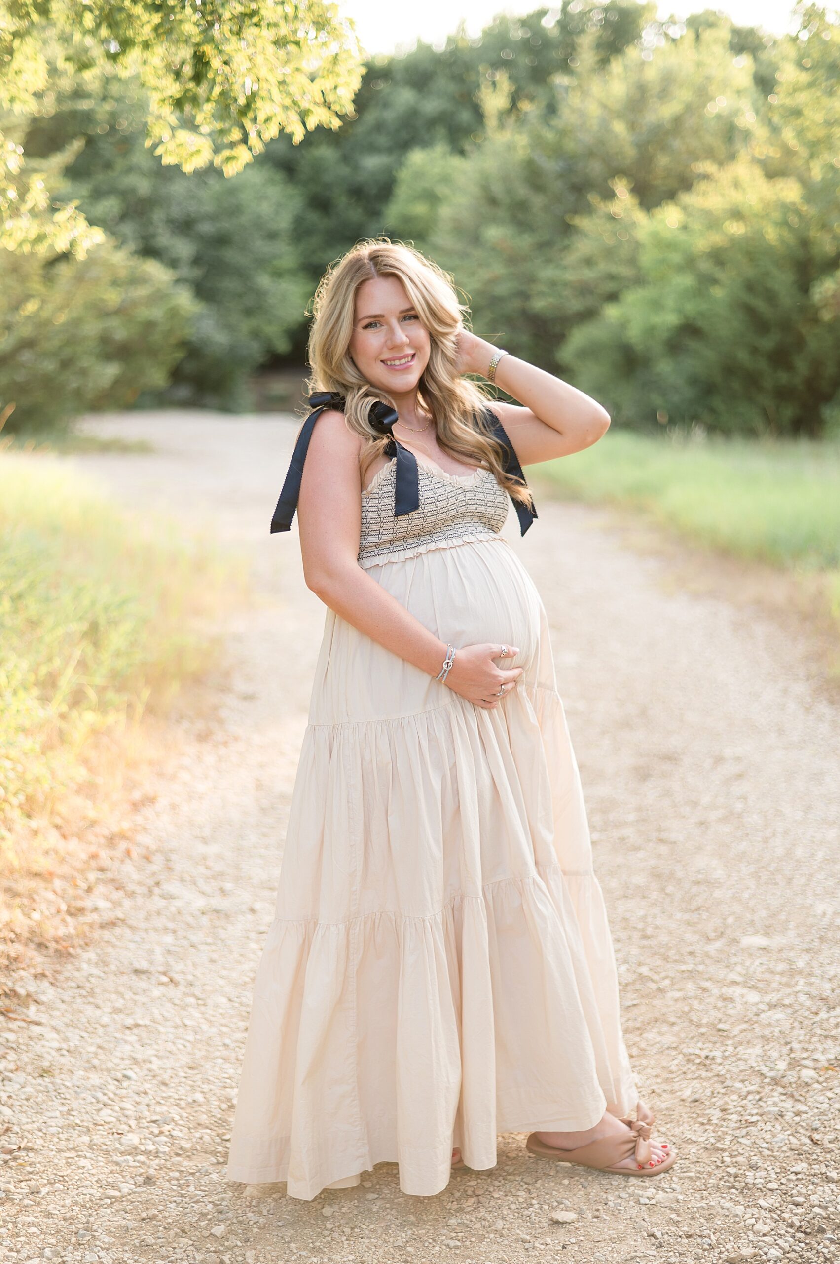 expectant mom in dreamy outdoor setting for maternity portraits 