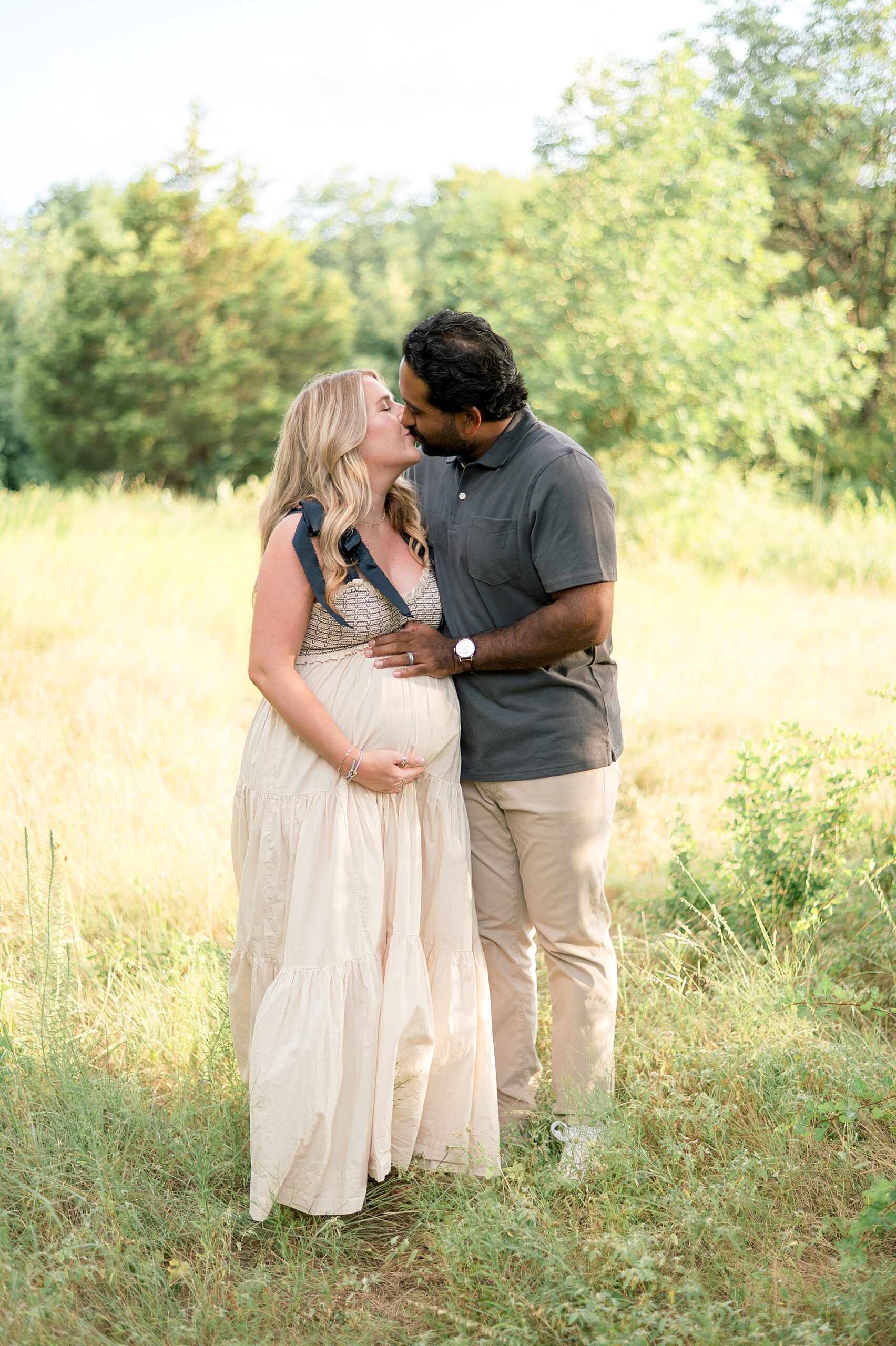 couple kiss during Golden Hour Maternity Session