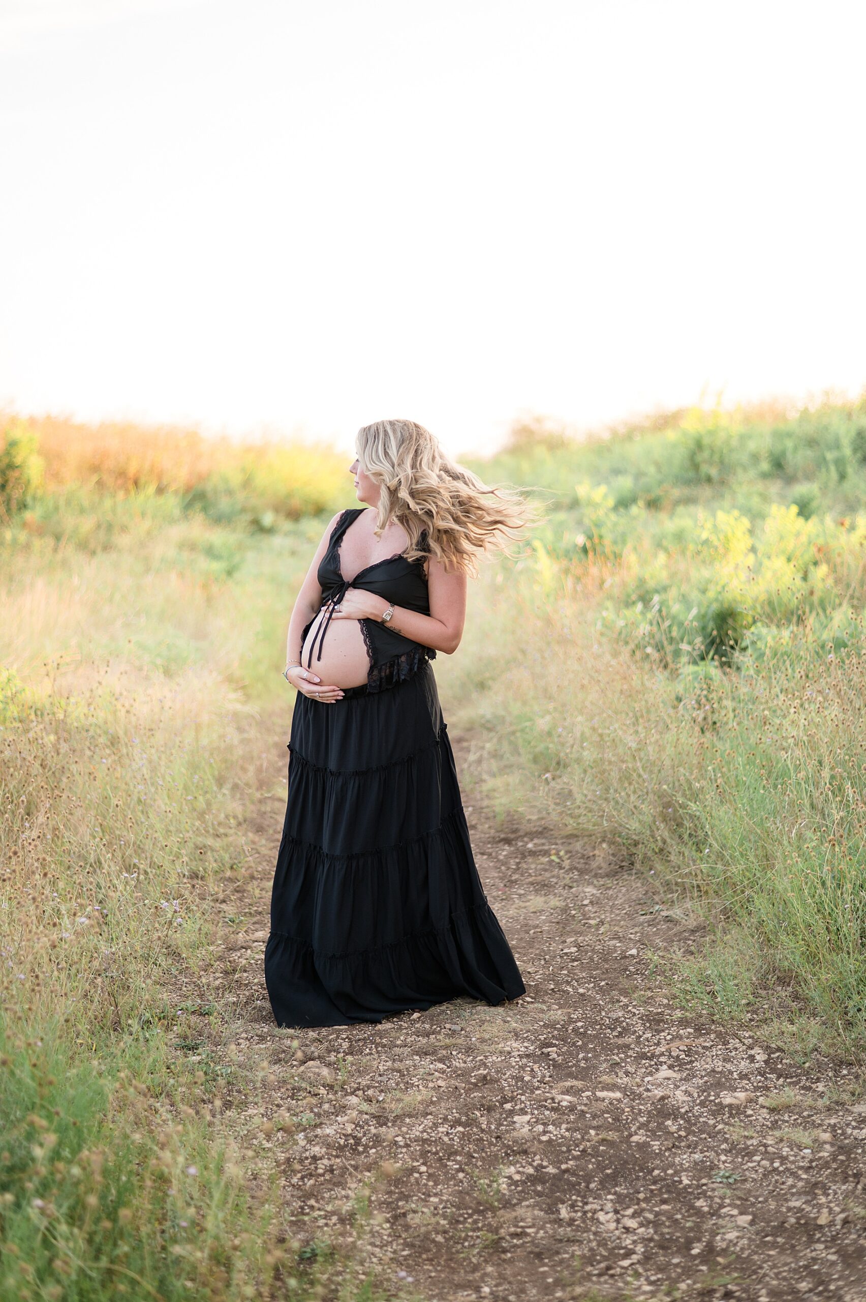 expectant woman in black two piece outfit 