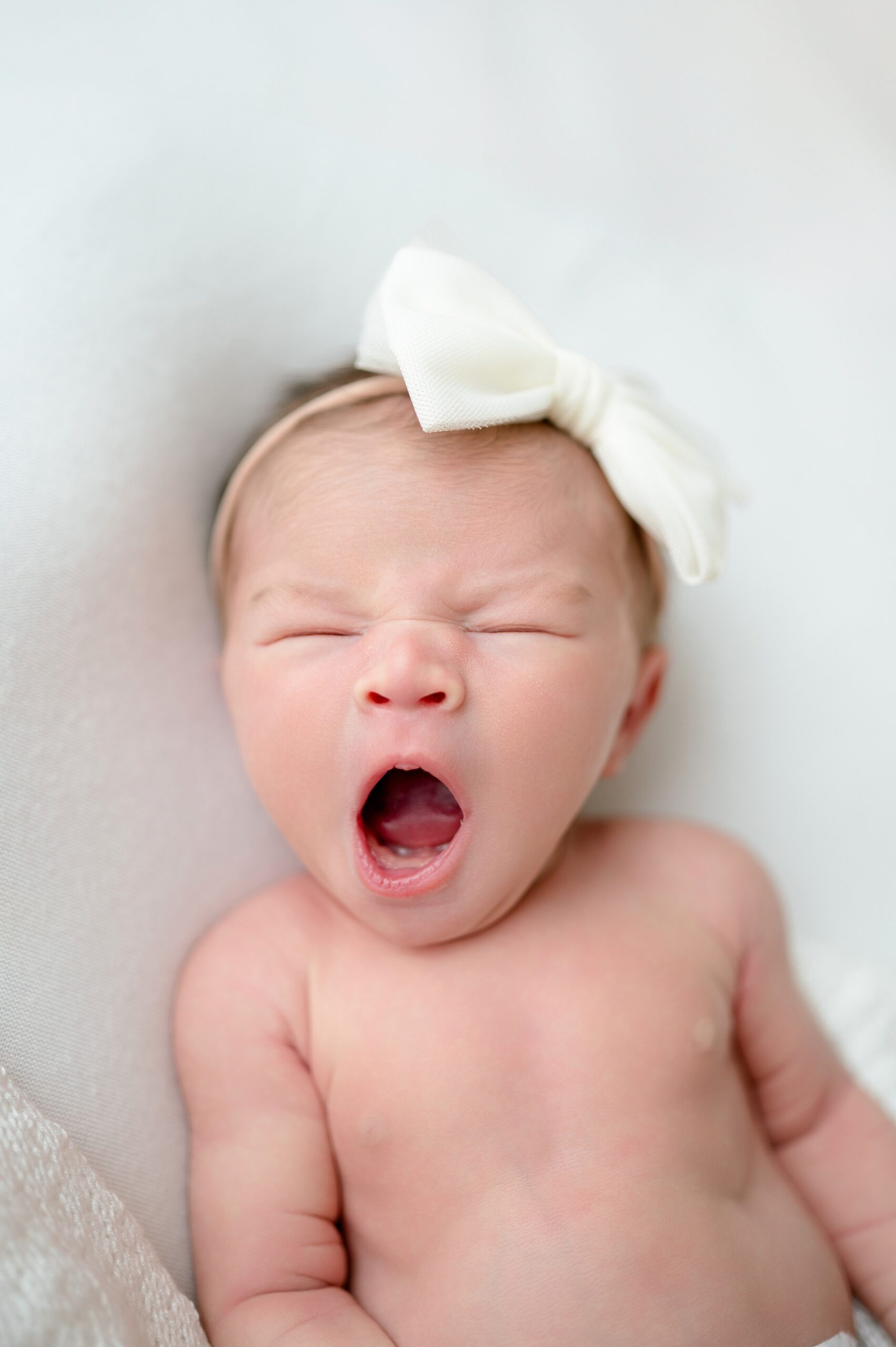 newborn yawns during little elm studio newborn session