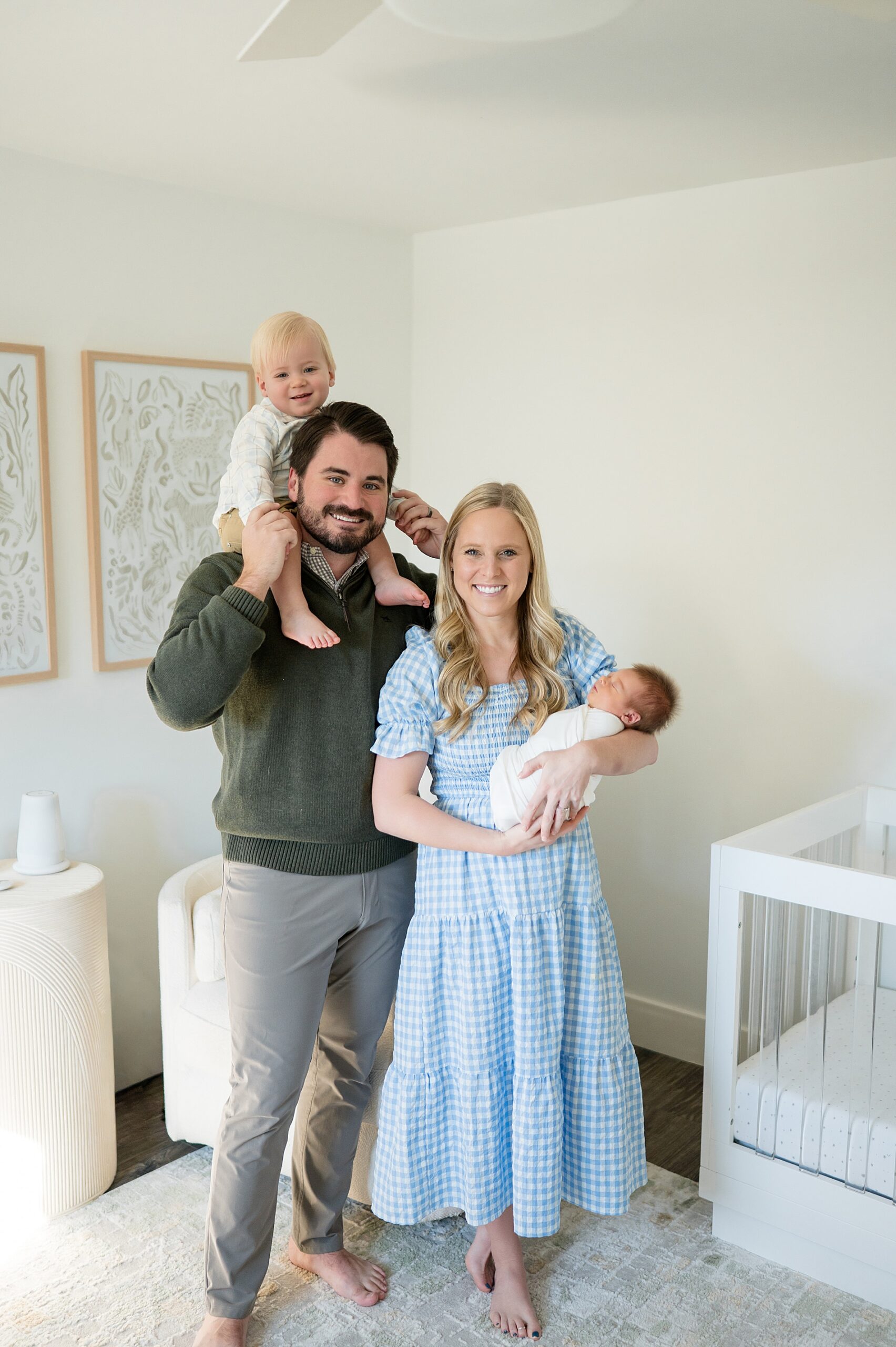 family in nursery during in-home lifestyle newborn session 