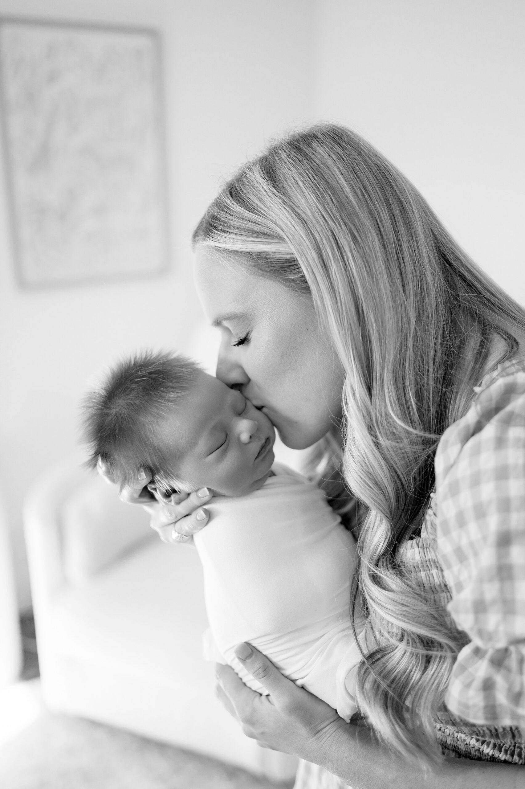 mom kisses newborn | Newborn photography in Plano, TX