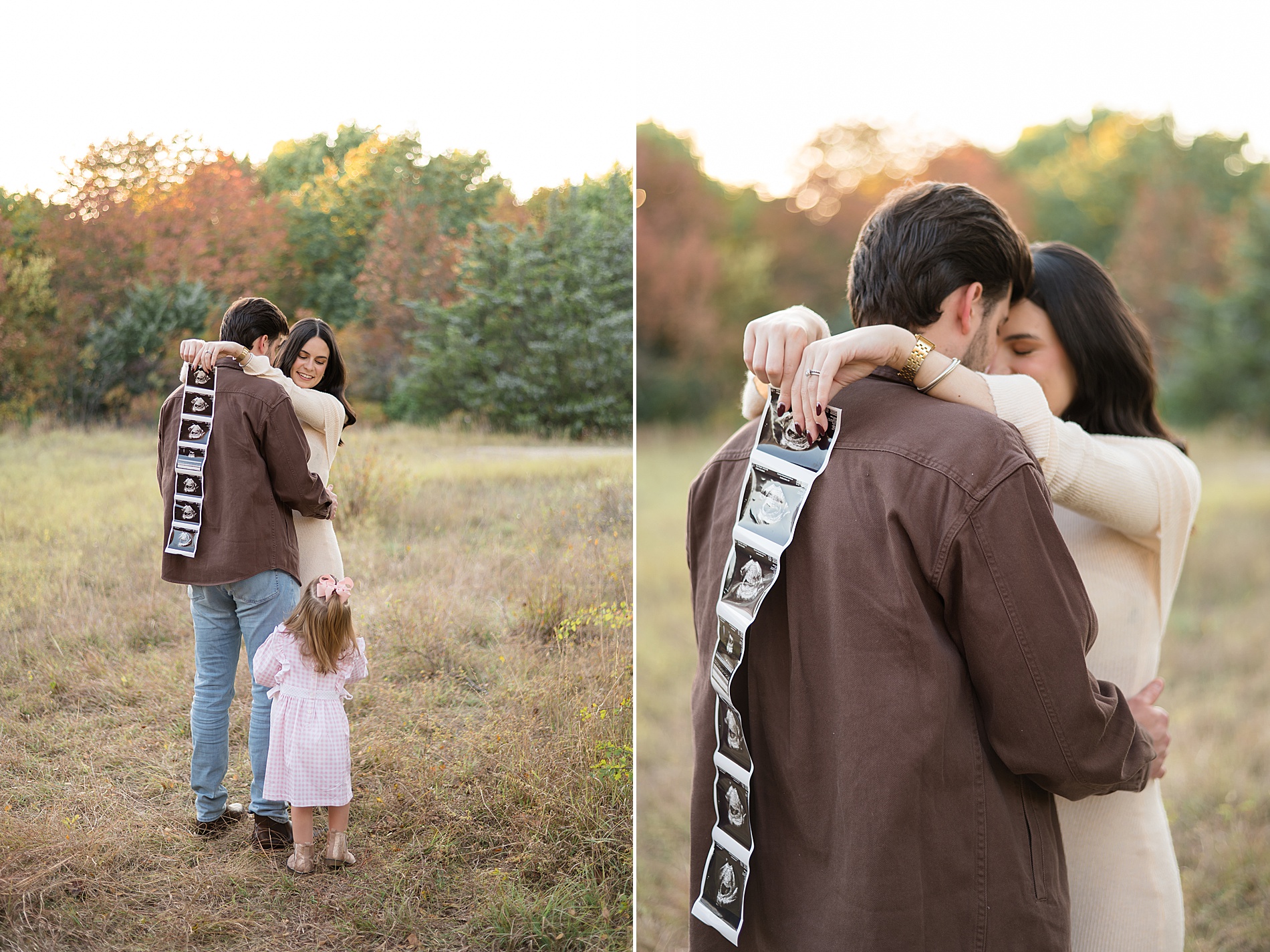 little girl in pink dress looks at ultrasound photo 