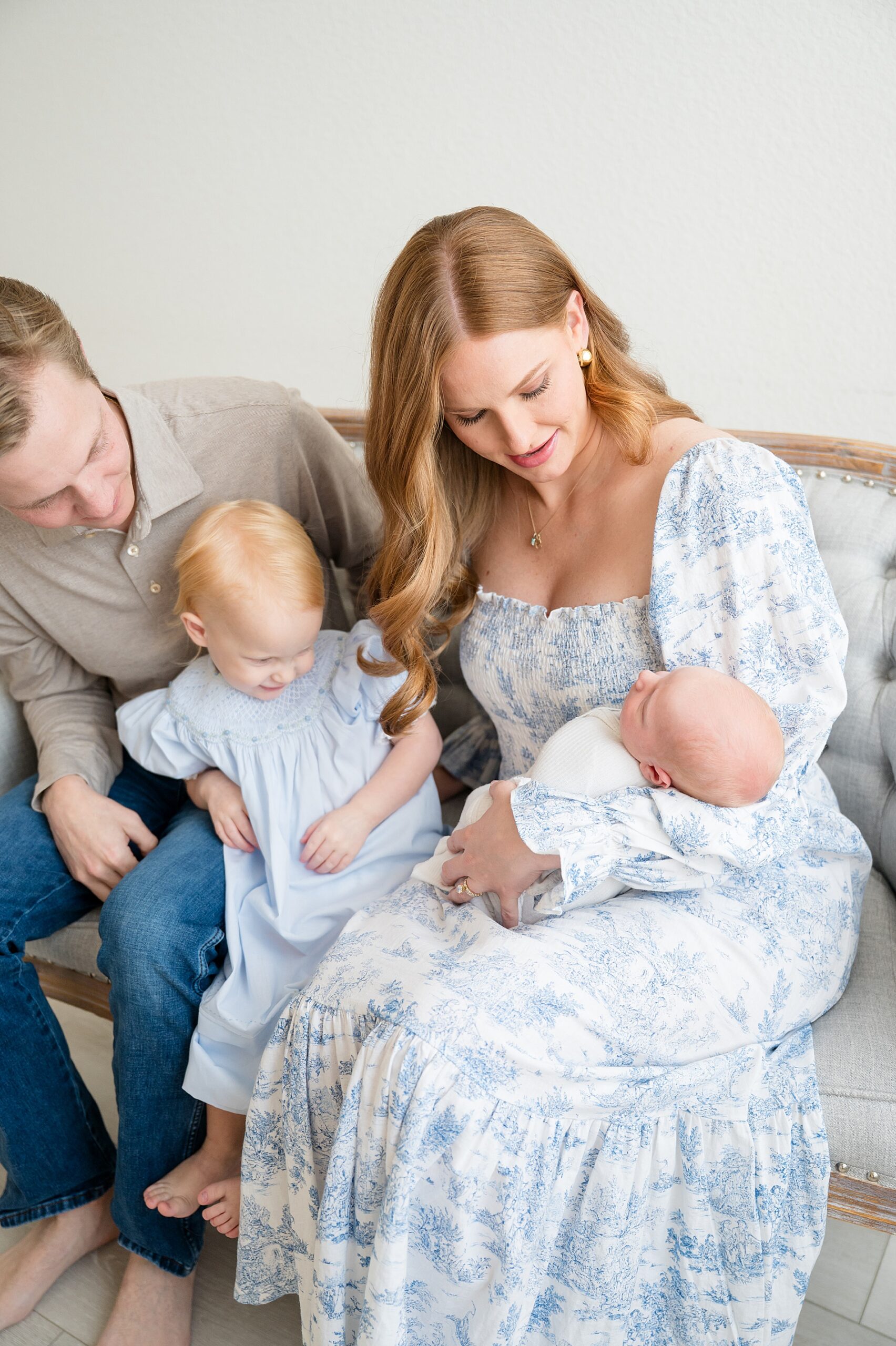 Newborn photographer in Little Elm Tx captures family of four during newborn session 